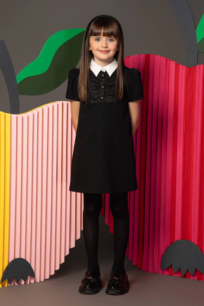 Black dress with white collar, front ruching and decorative buttons