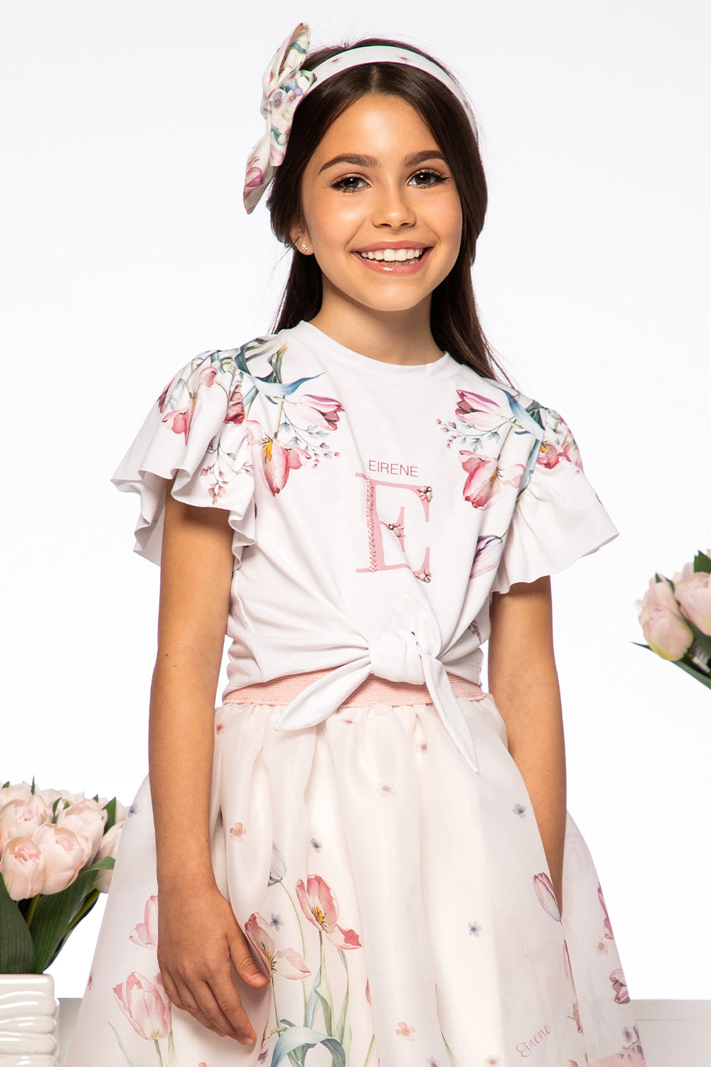 White tulip print t-shirt with hand-embellished logo and bow