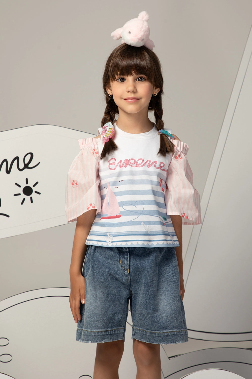 High-waisted denim shorts with a ruffled waistband, heart charm chain, and a relaxed, wide-leg fit