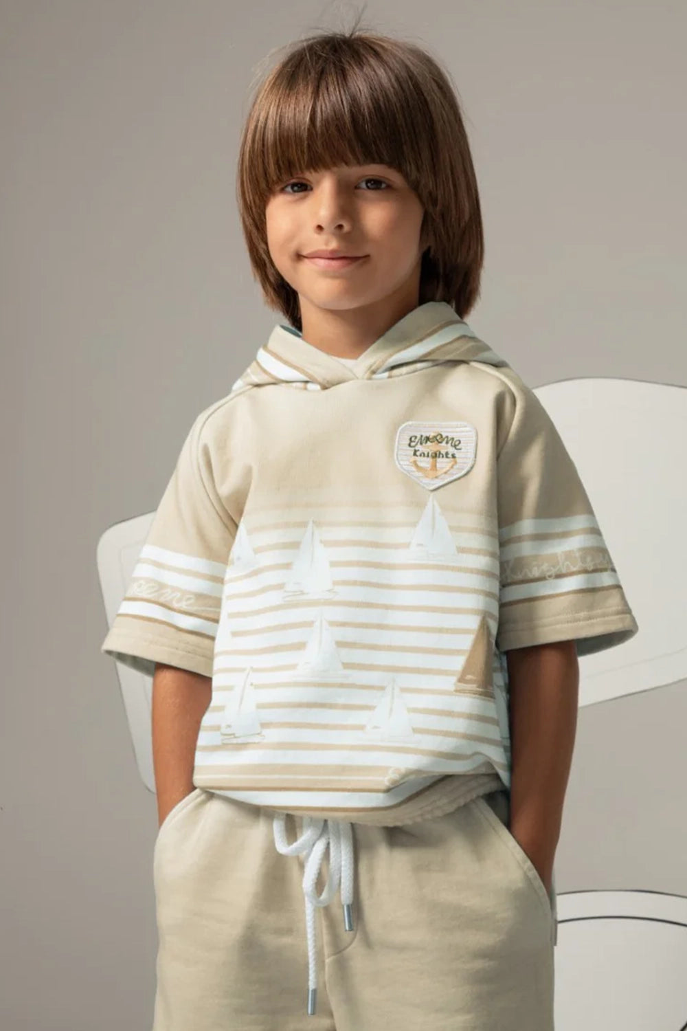 Beige short-sleeved striped hoodie with a sailboat print