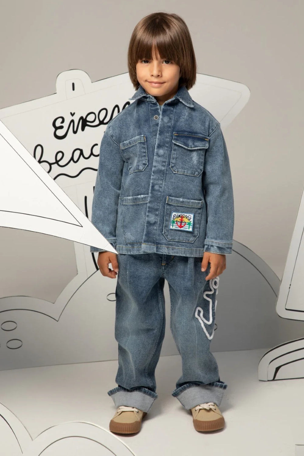Relaxed-fit denim jeans with cuffed hems and anchor detail on the leg
