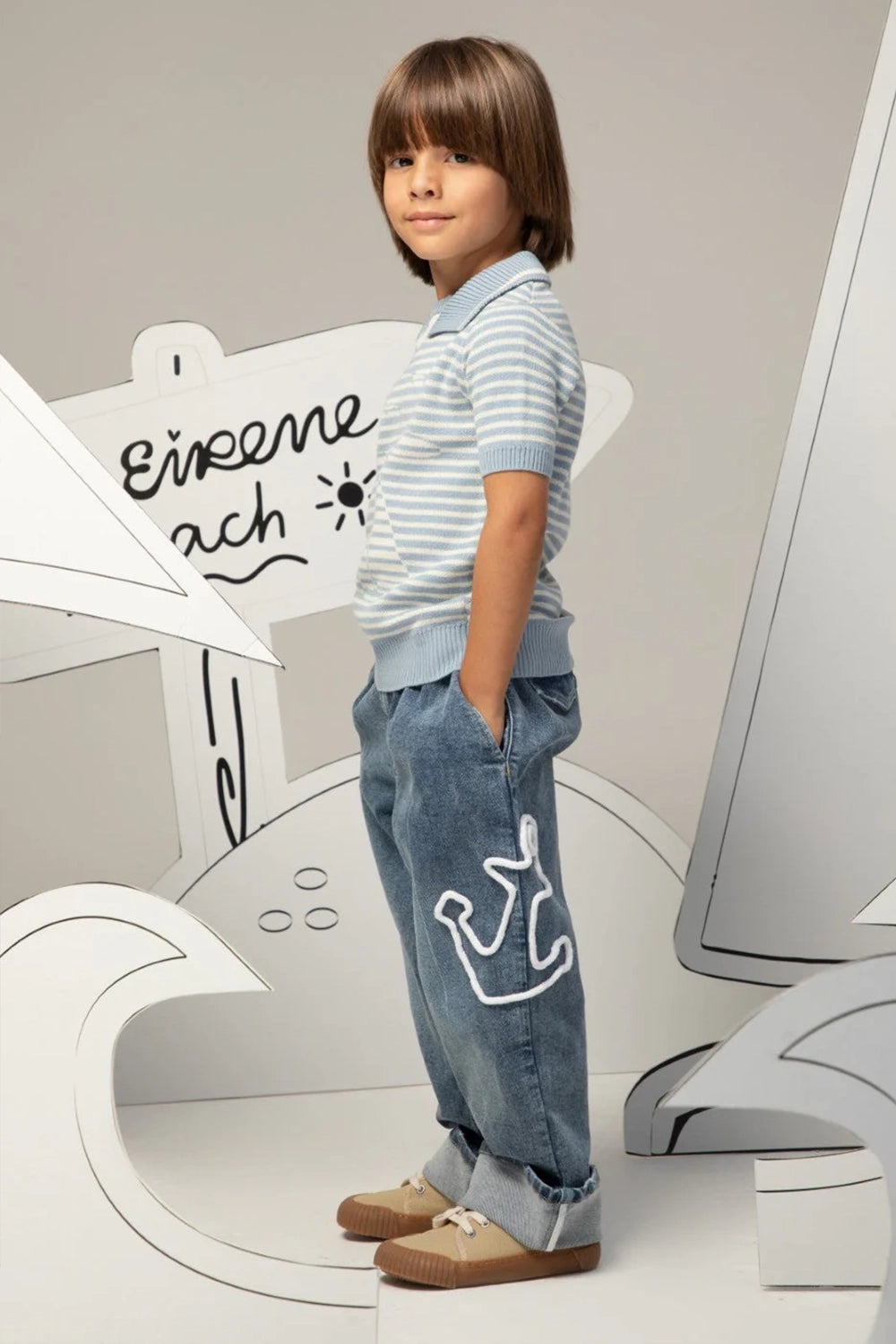 Relaxed-fit denim jeans with cuffed hems and anchor detail on the leg
