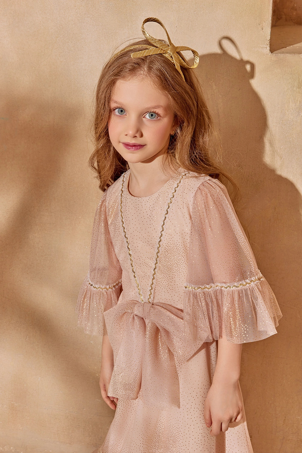 Dusty pink glitter tulle dress with flounced sleeves and a big bow
