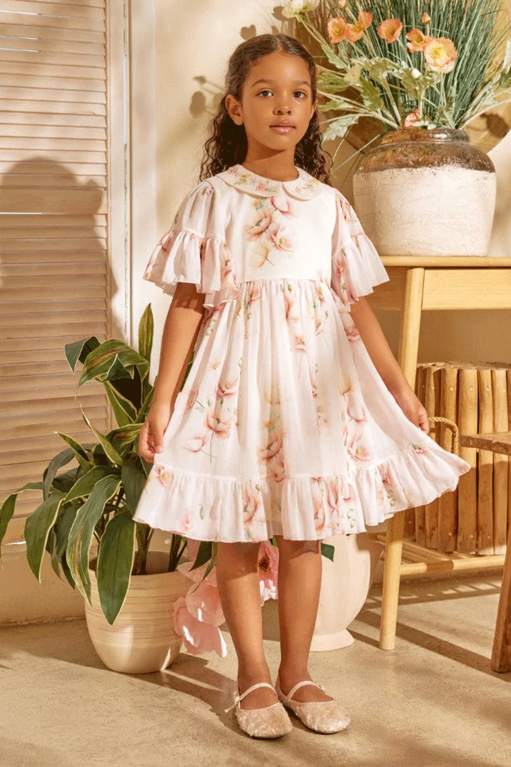 Chiffon shimmering floral dress with flutter sleeves, ruffled hem, and hand-embroidered peter pan collar