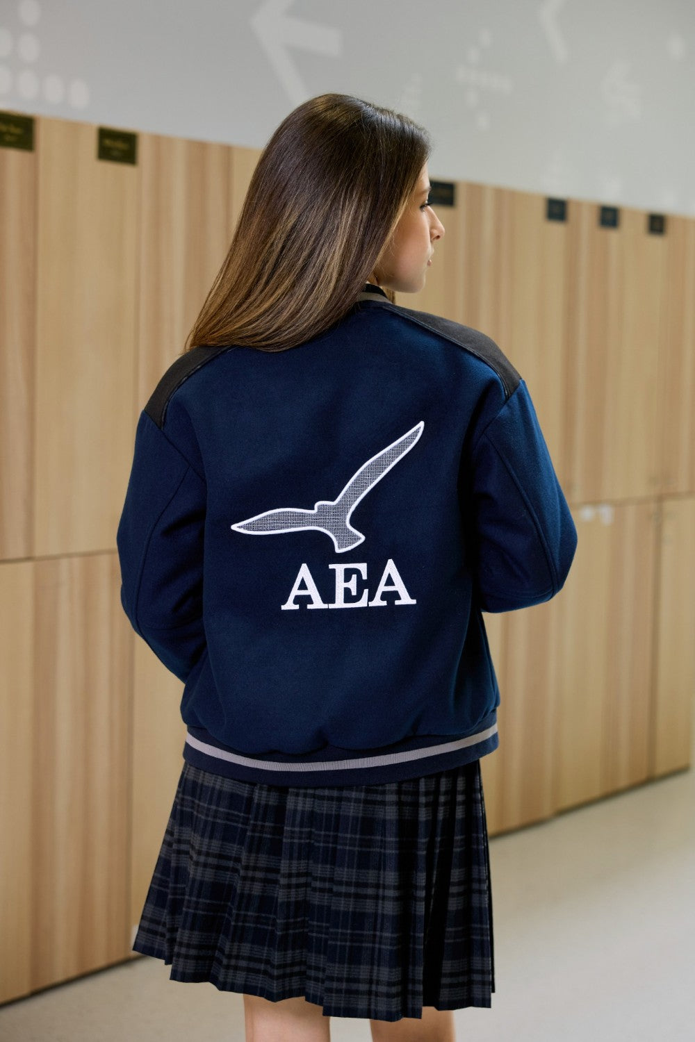 Navy bomber jacket for teen girls with logo