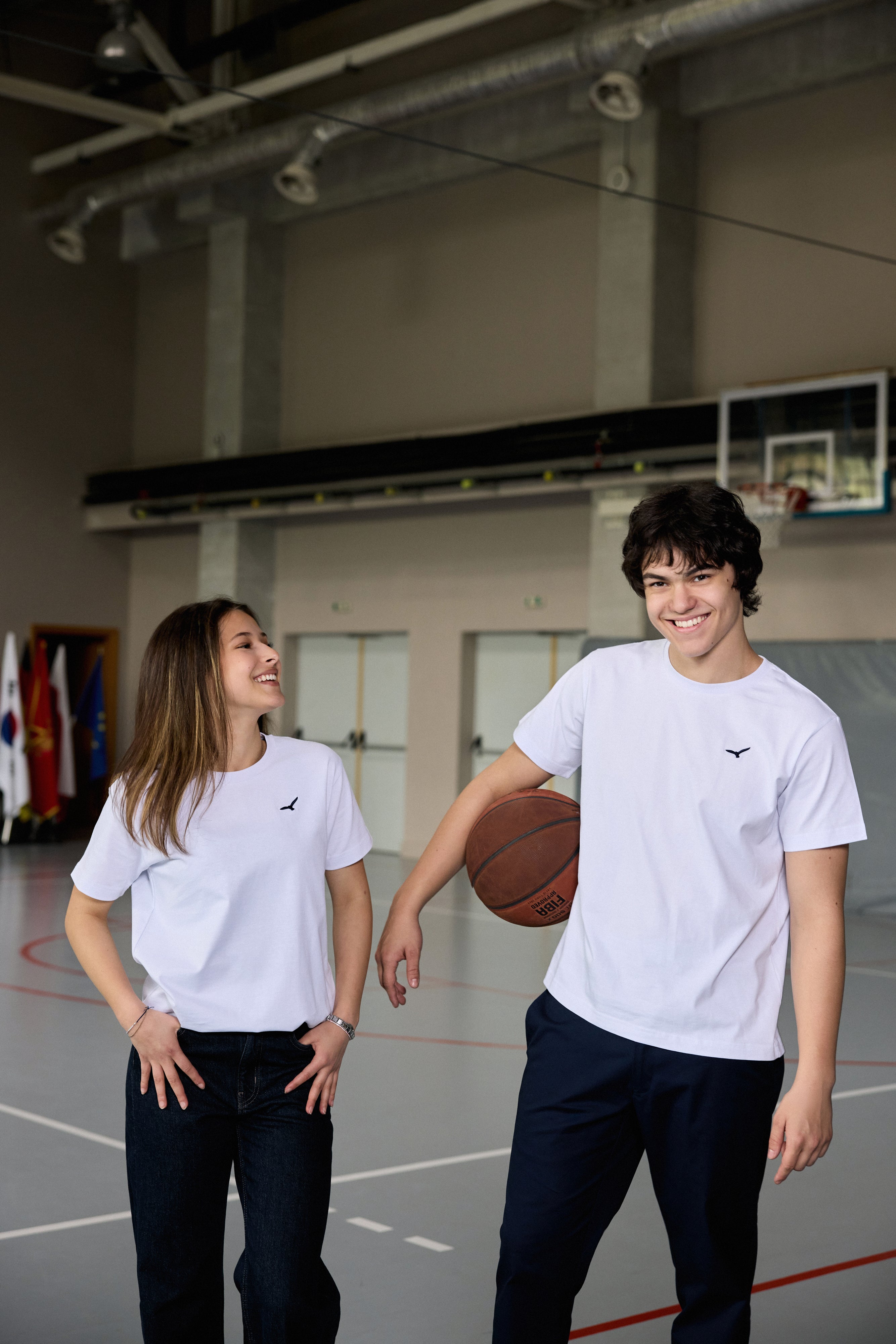 White cotton t-shirt for teen girls with AEA logo