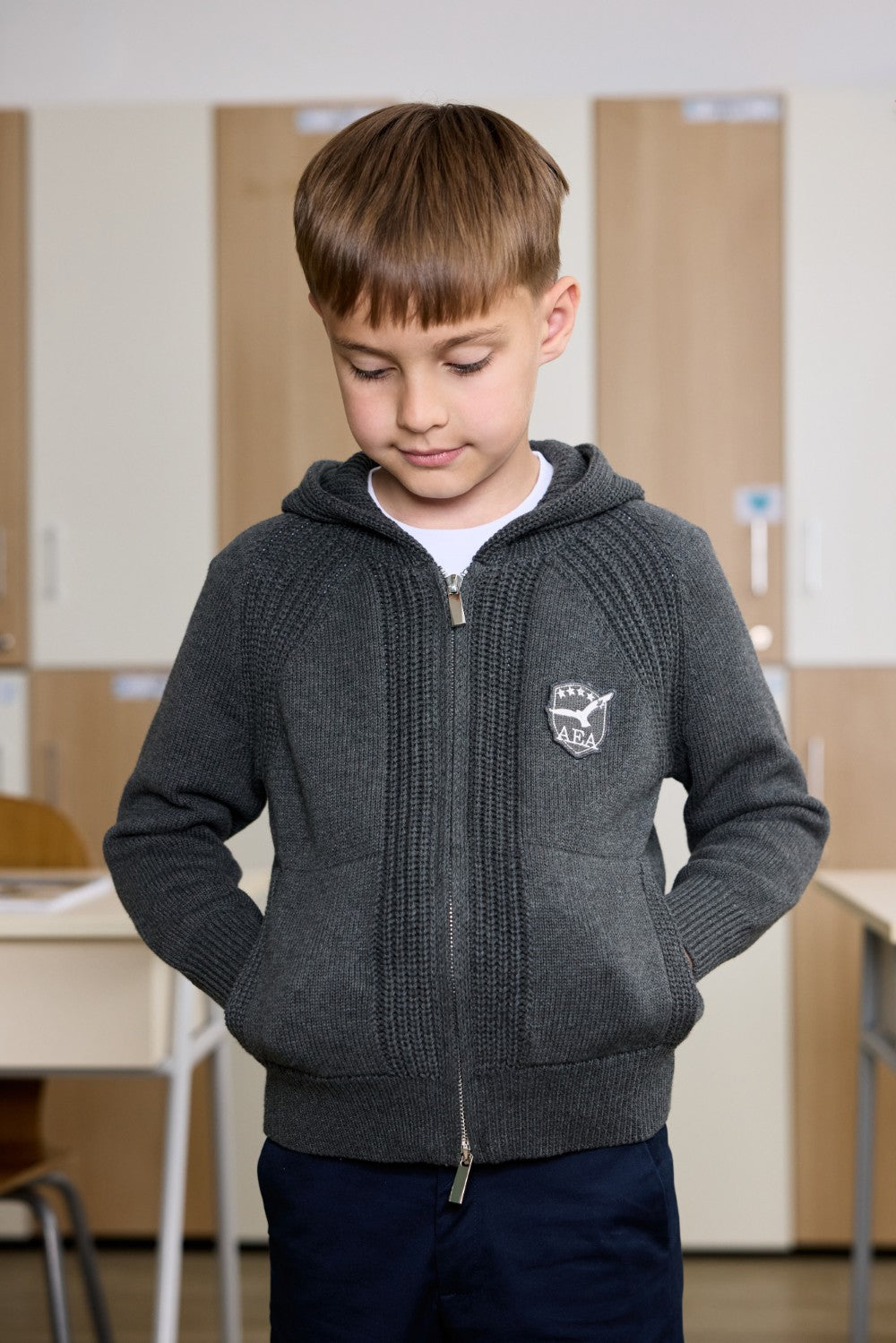 Grey unisex zip-up hoodie with ribbed texture