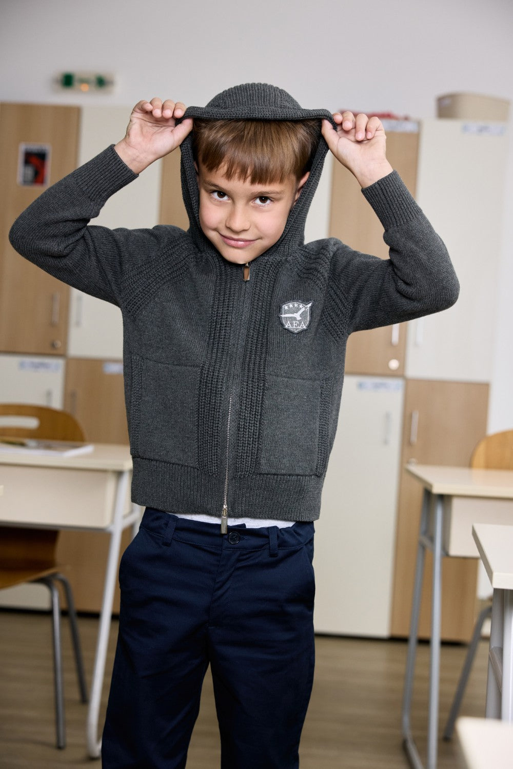 Grey unisex zip-up hoodie with ribbed texture