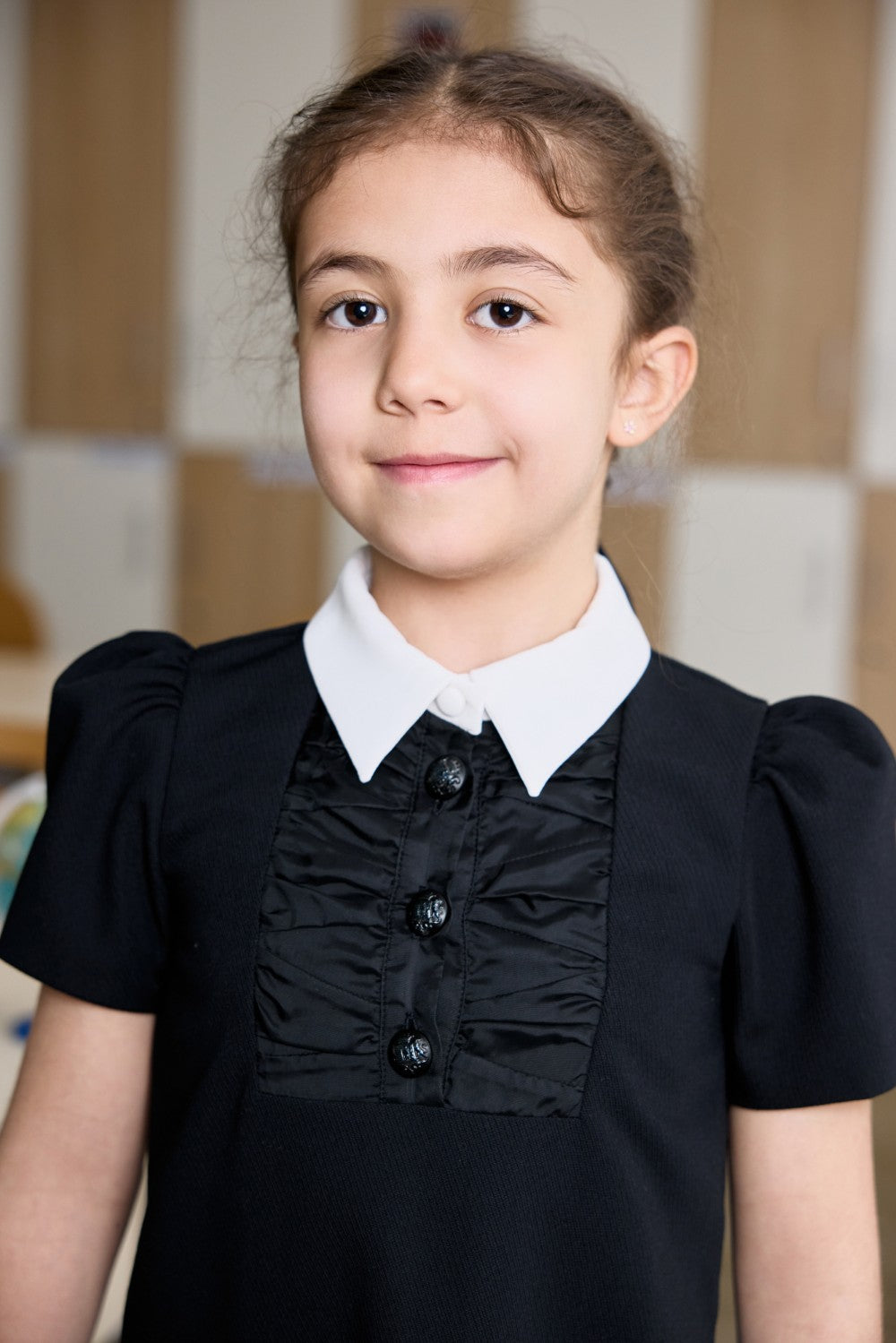 Black dress with a white collar and ruched satin front