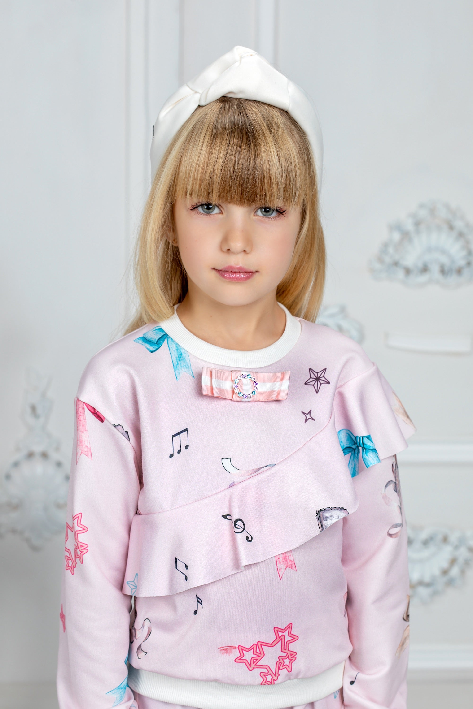 Light pink tracksuit with bows print and ruffles