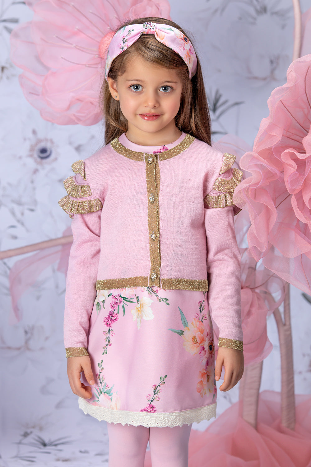 Pale pink and gold knitted cardigan with frills and crystal buttons