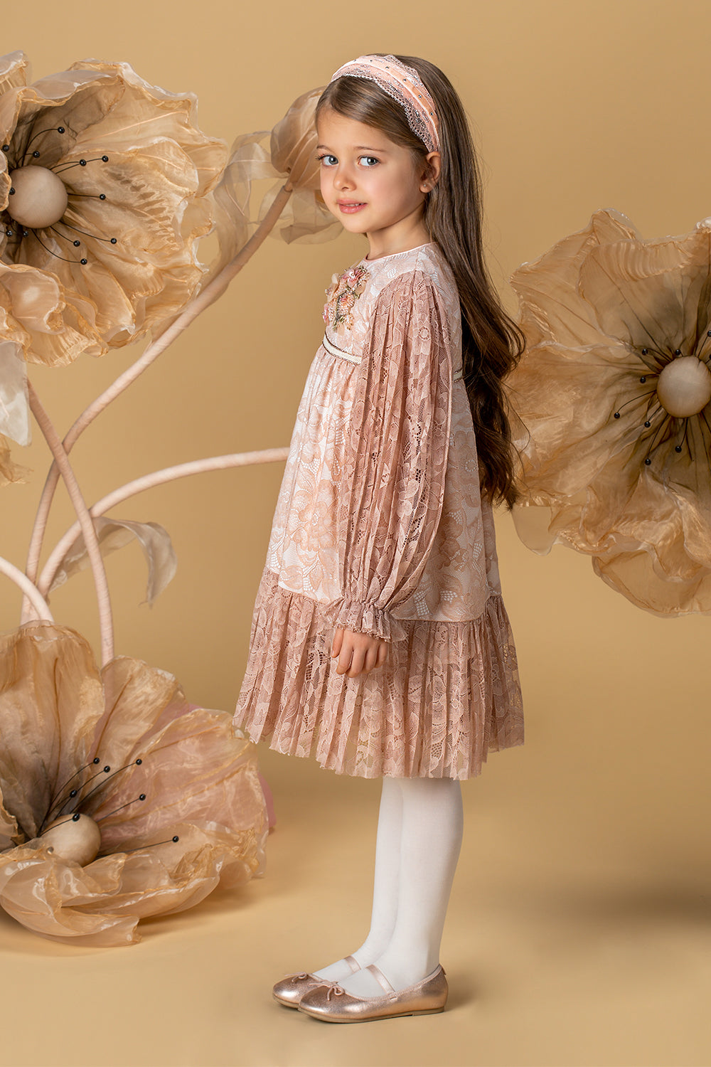 Pale pink pleated lace dress with a handmade embellishment