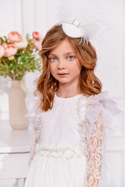 White lace dress with with pearls and organza bow and frills