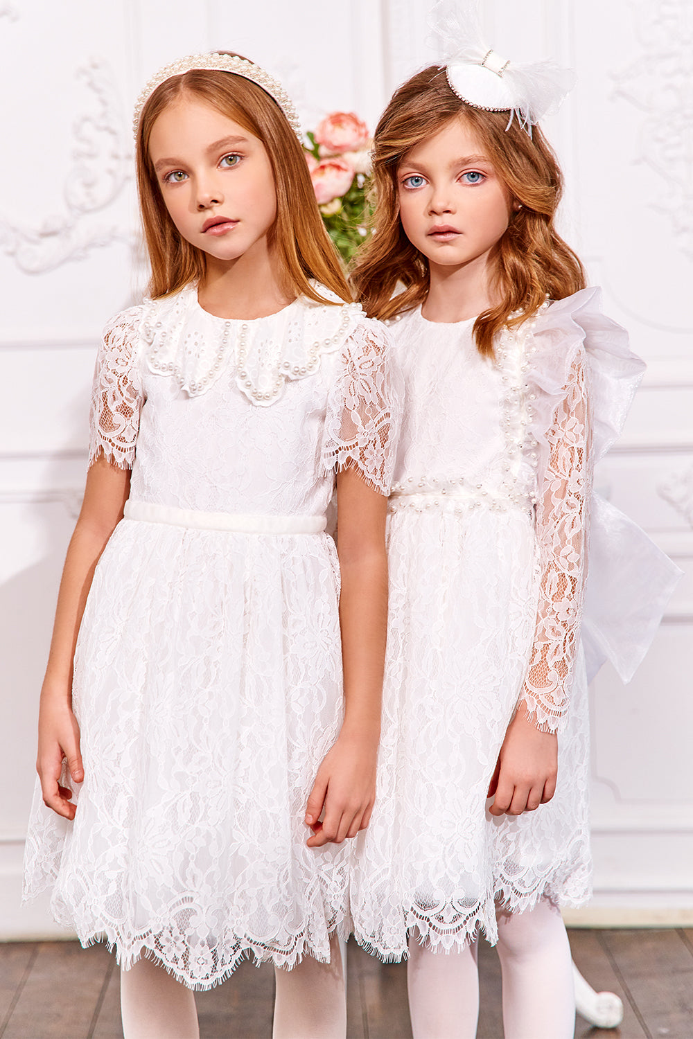 White lace dress with with pearls and organza bow and frills