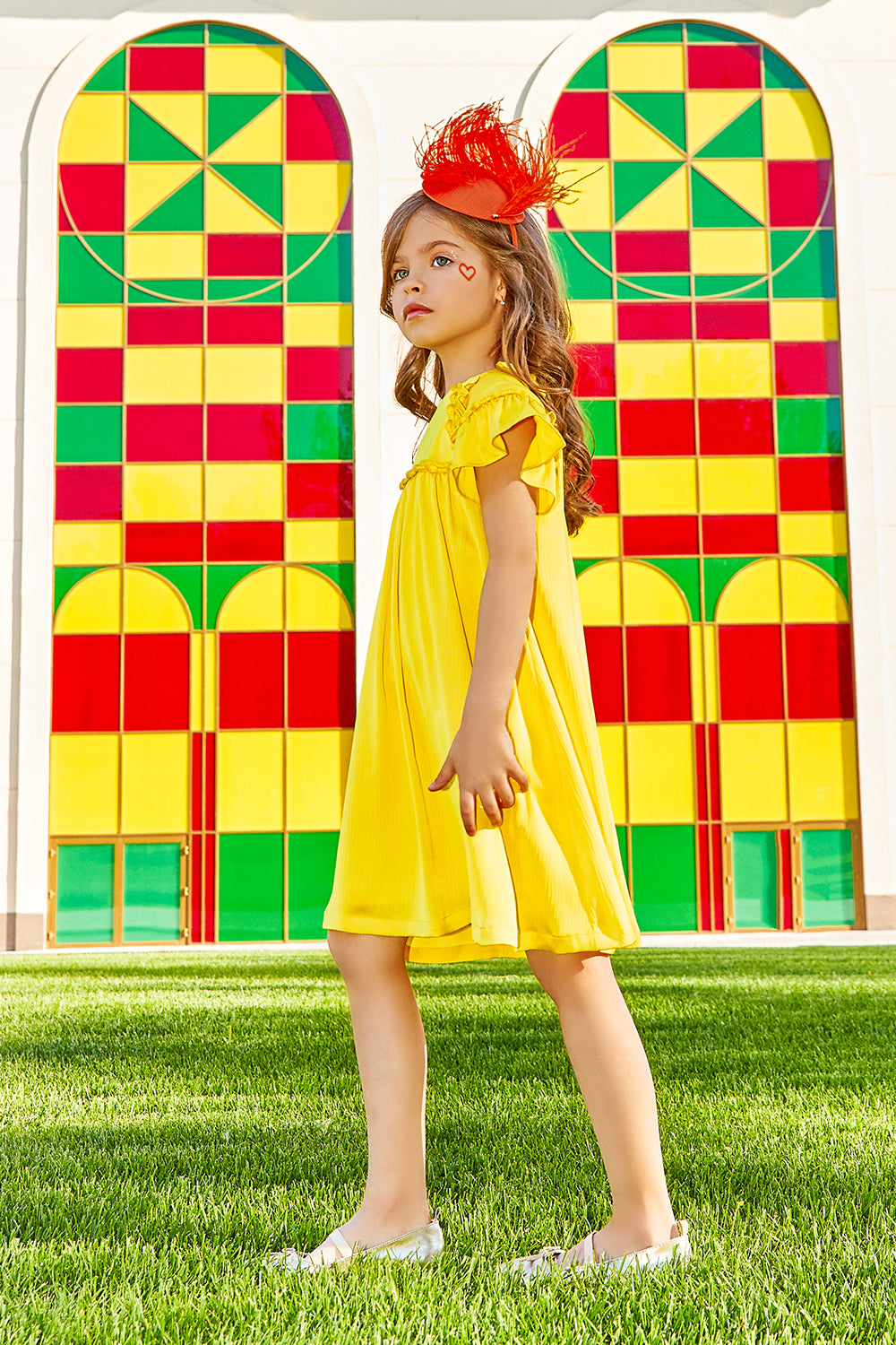 Bright yellow flare dress with matching trimming