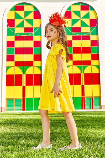 Bright yellow flare dress with matching trimming