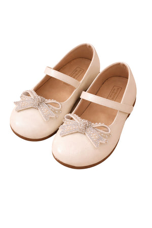 White shoes with a decorative bow