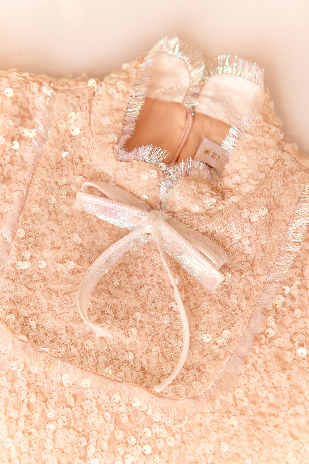 Powder pink sequin glittery dress with bow and fringes