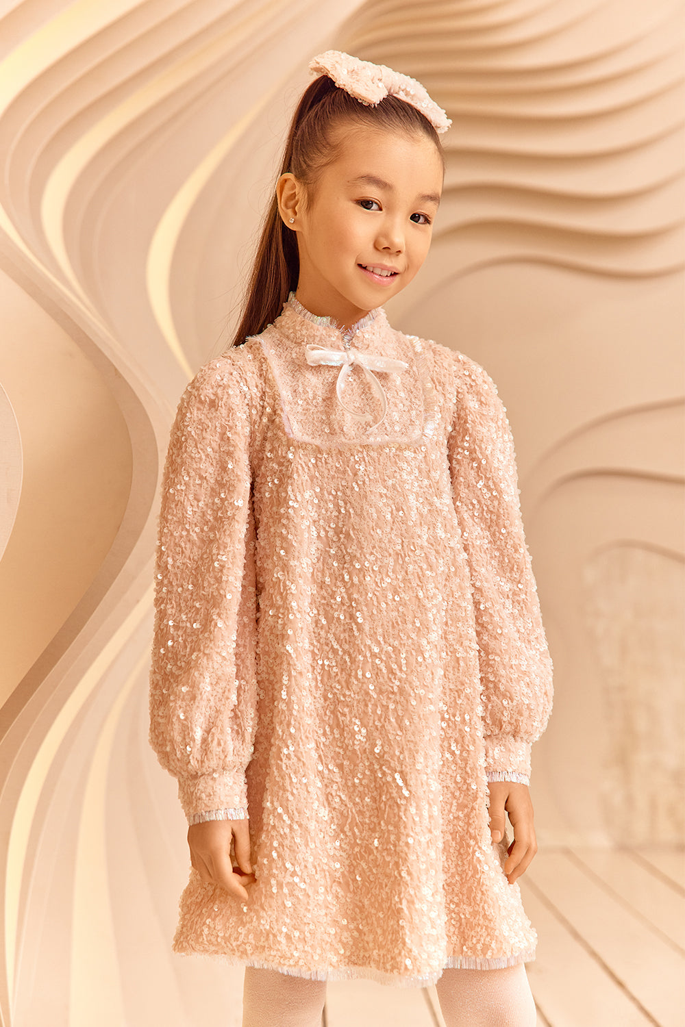 Powder pink sequin glittery dress with bow and fringes