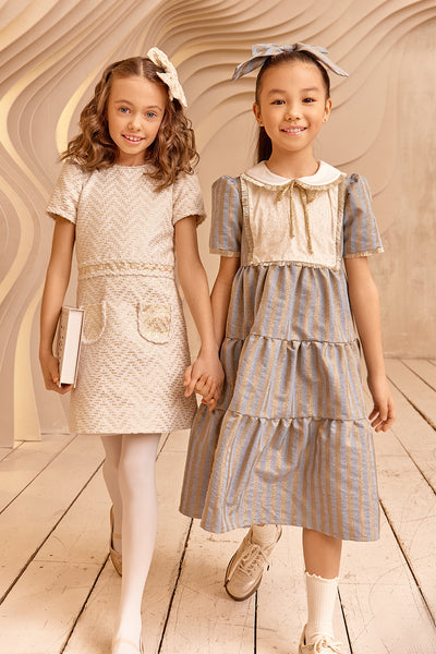 Denim and gold striped dress with white collar and gold details