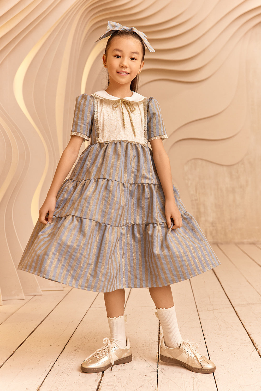 Denim and gold striped dress with white collar and gold details