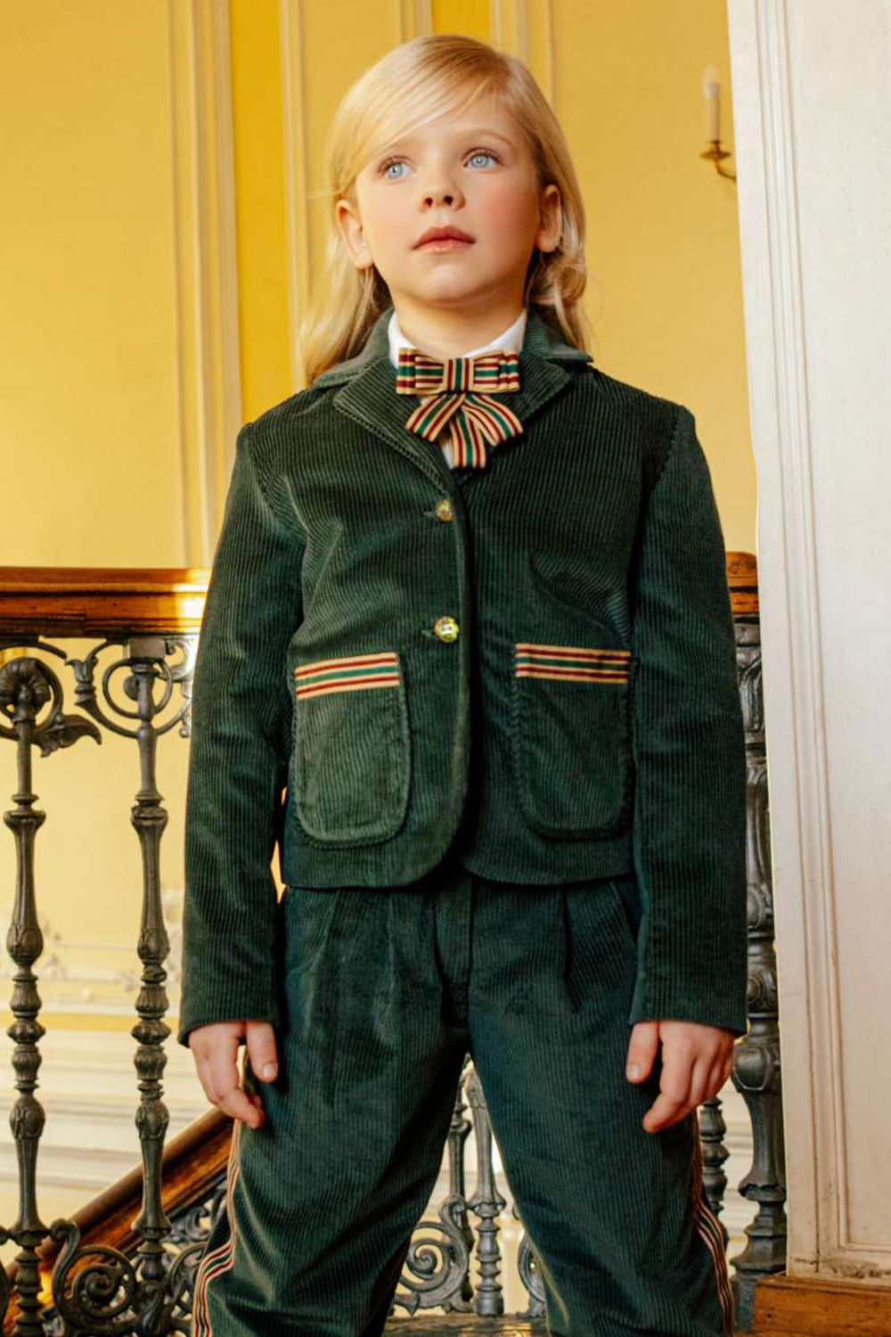 Green courdory jacket with colored ribbons on the pockets