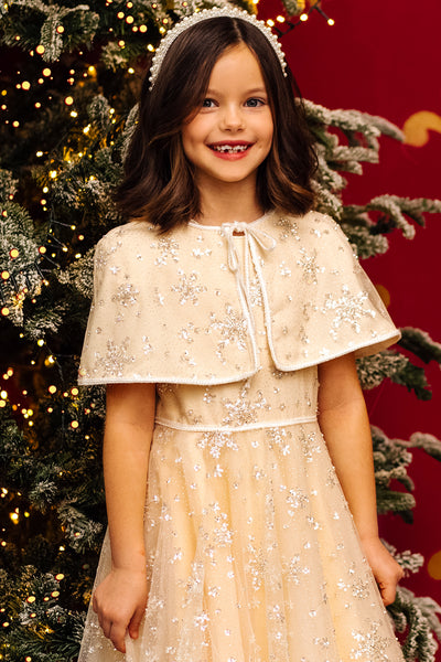 عباءة ثلجية مزينة بالترتر باللون العاجي