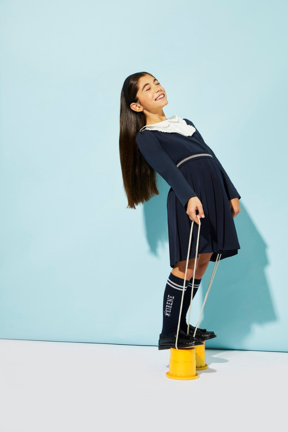 Blue jersey top with white front detail and collar