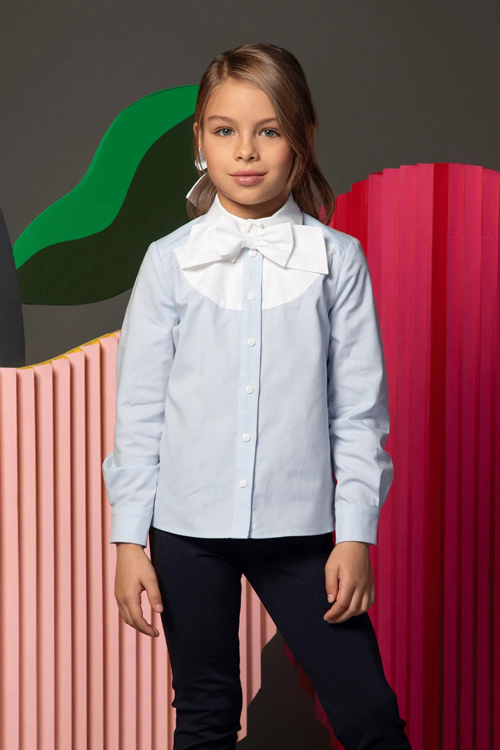 Light blue shirt with white collar and large bow