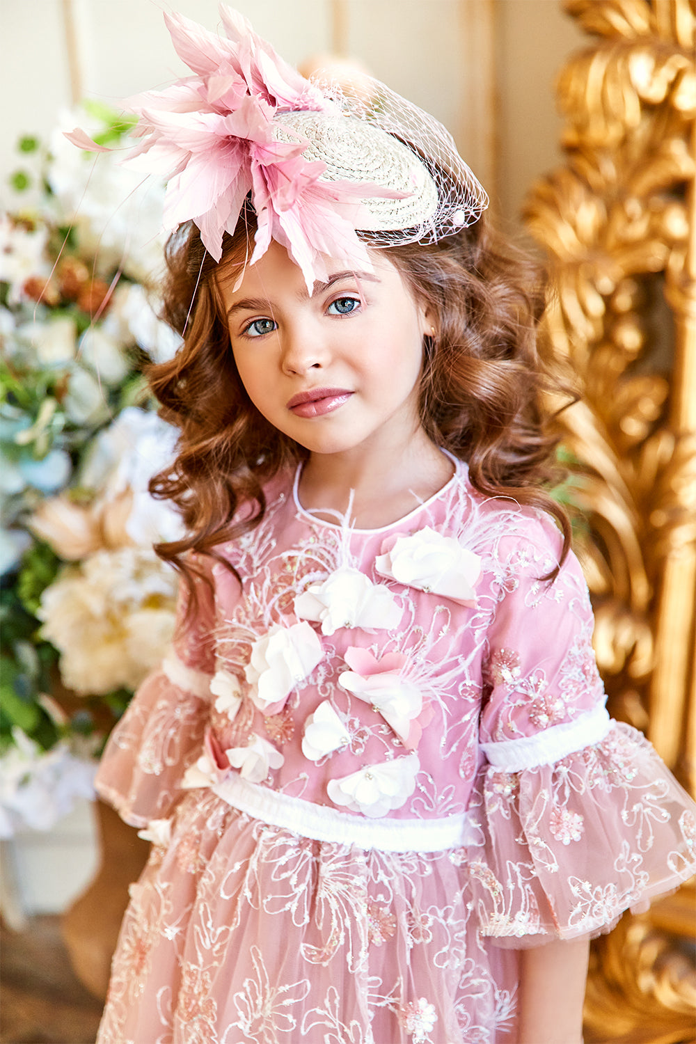 Pink and white floral lace dress with frilled sleeves and hand-made flower and feathers decoration