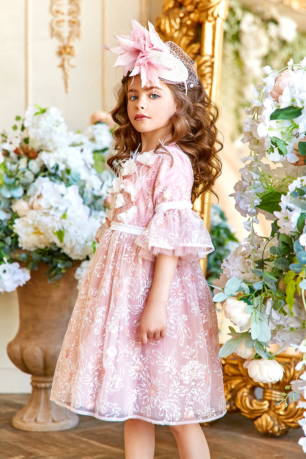 Pink and white floral lace dress with frilled sleeves and hand-made flower and feathers decoration