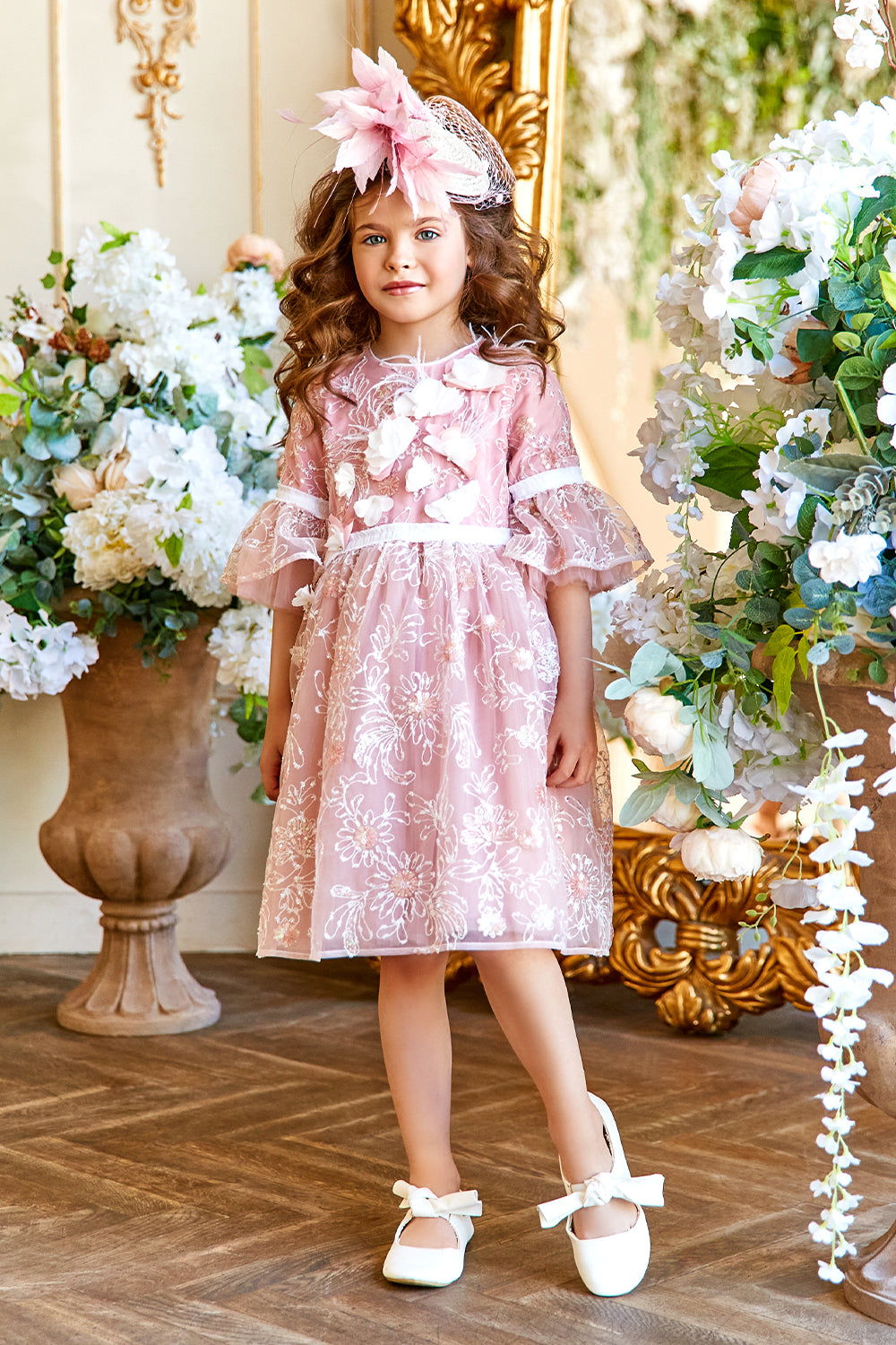 Pink and white floral lace dress with frilled sleeves and hand-made flower and feathers decoration