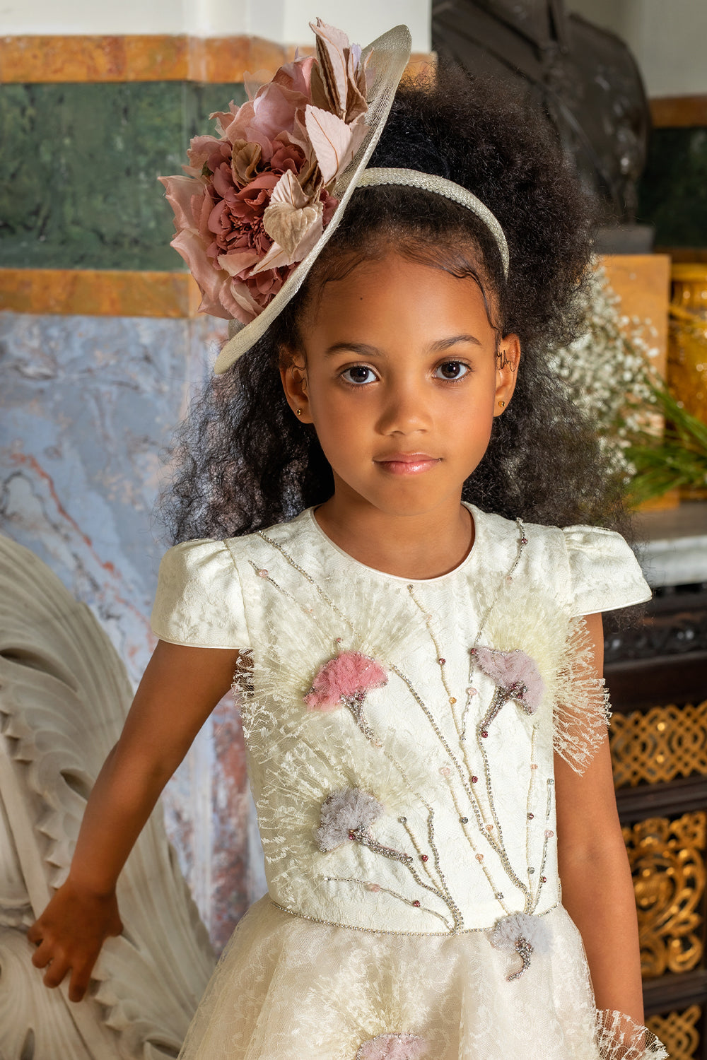 Off-white fascinator with pink flowers