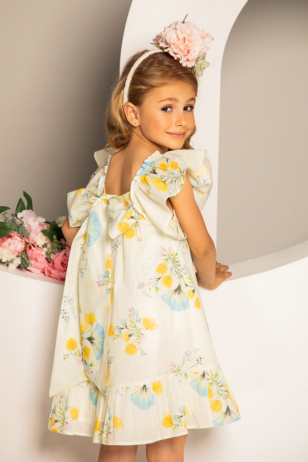 Pale yellow satin cotton floral print dress with big bow on the back