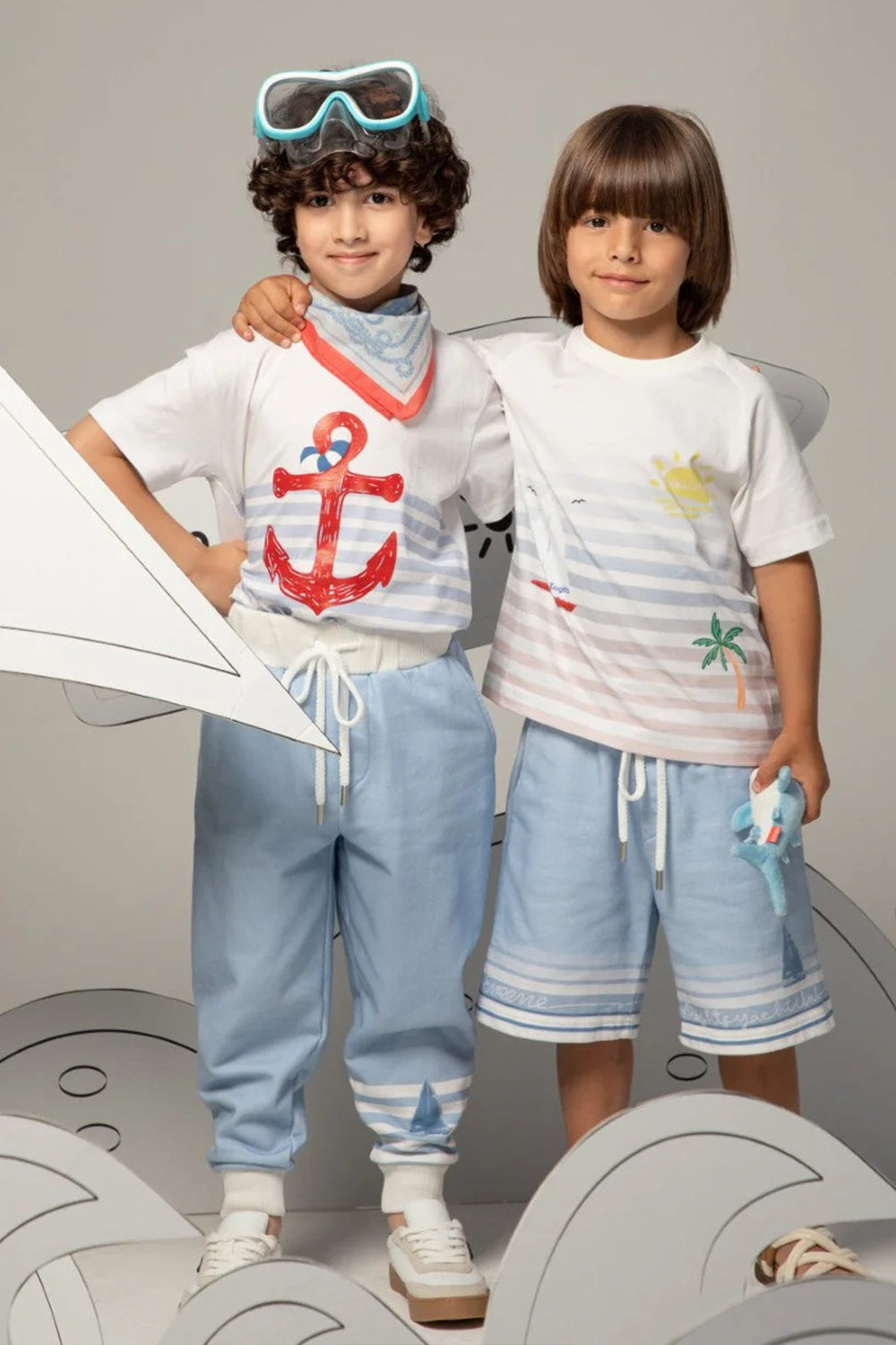 Light blue drawstring shorts with striped print