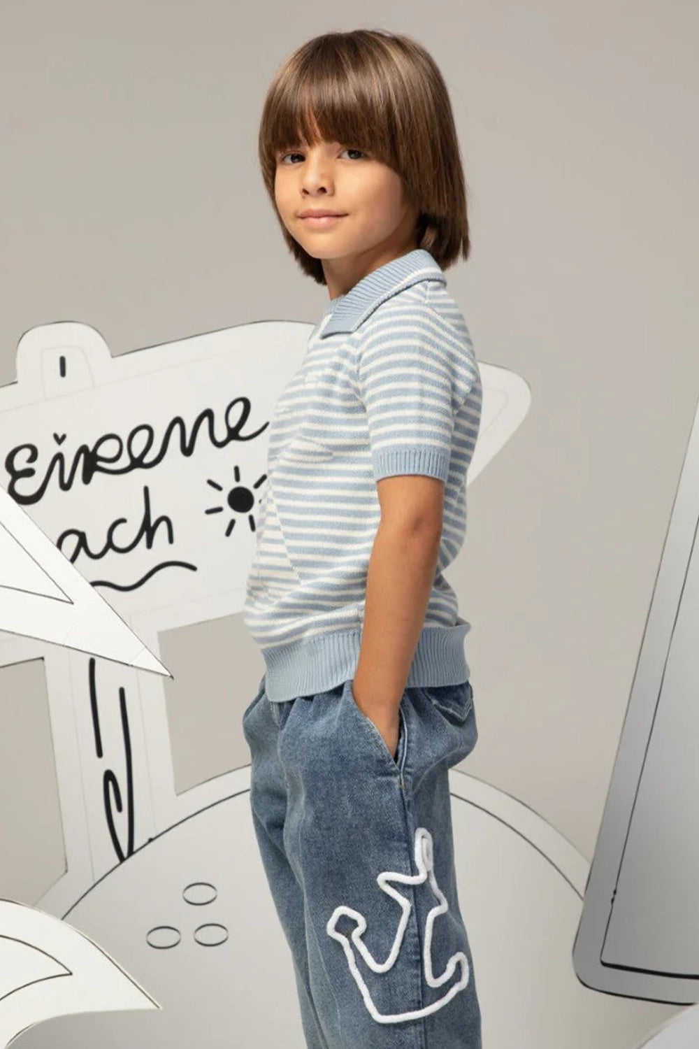 Light blue and white striped knit shirt with a sailor collar and short sleeves