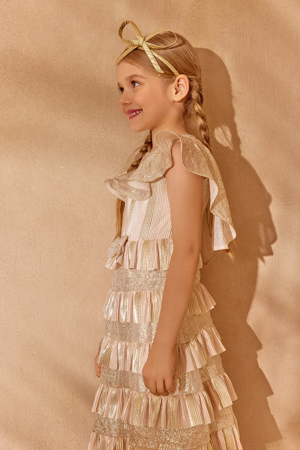 Gold and blush pleated ruffle dress with shimmer details and bow