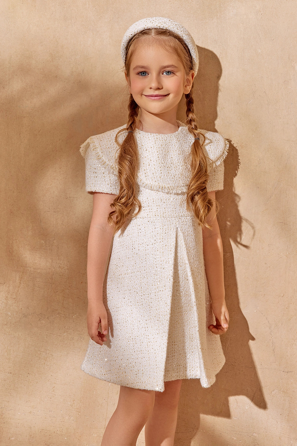 Elegant white tweed dress with pleated front and fringe trim