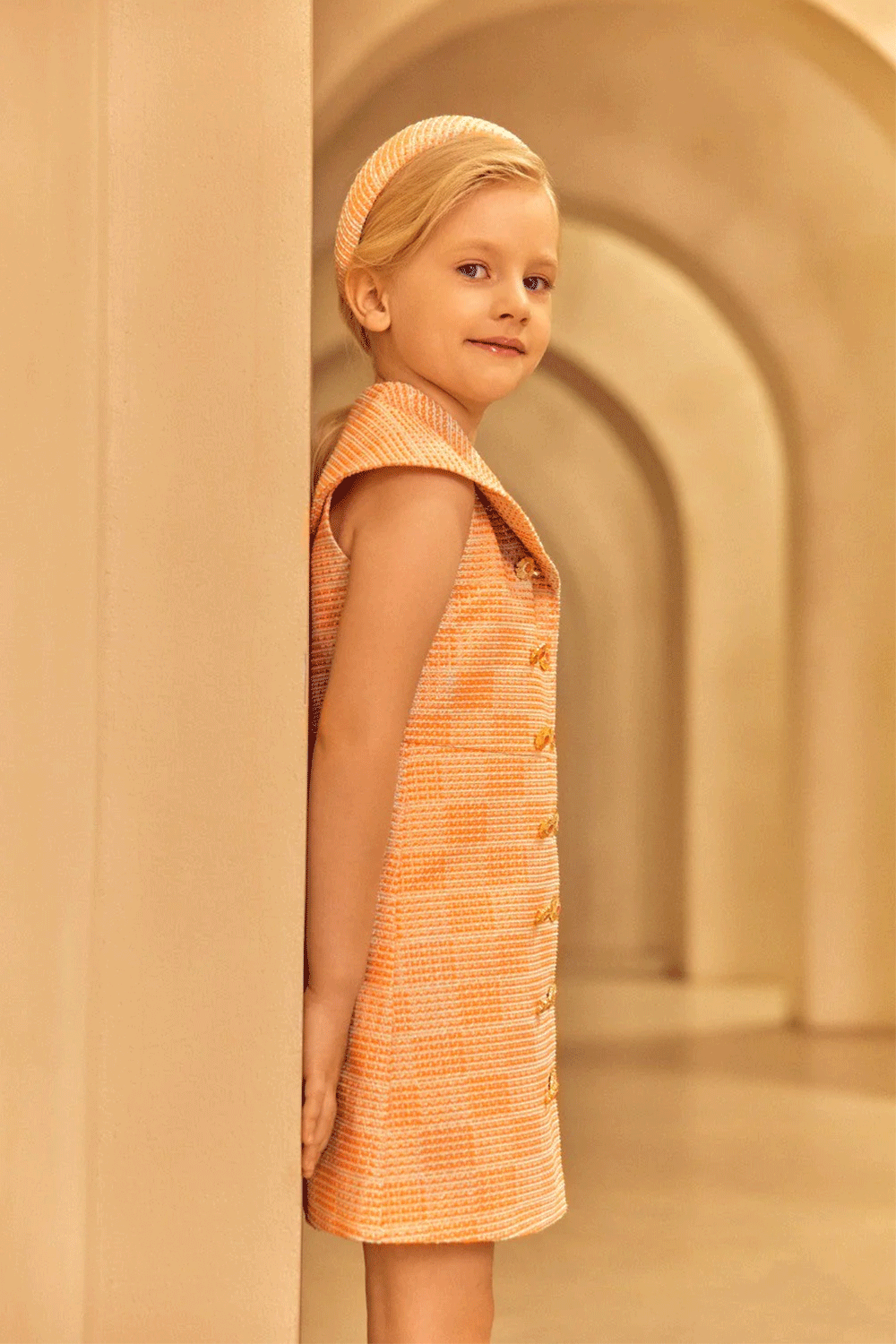 Sleeveless A-line dress in coral, aqua and rose gold tweed with a wide sailor collar and double-breasted button detail
