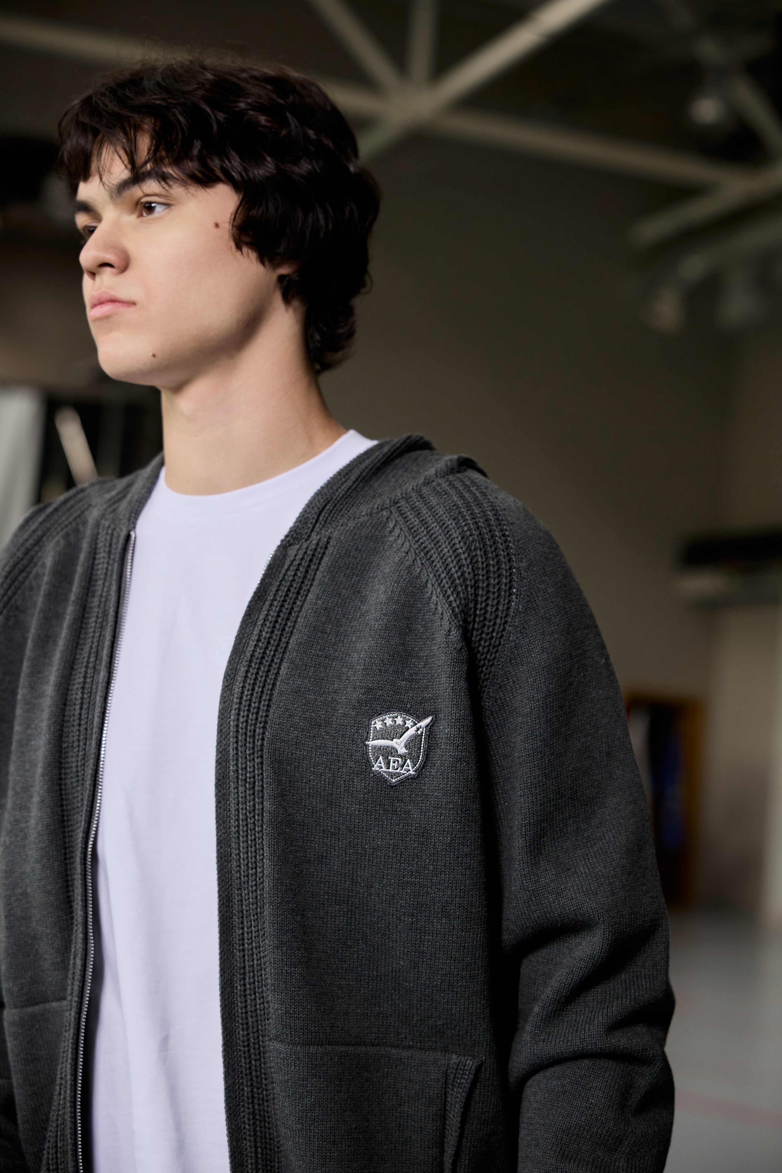 Unisex grey zip-up hoodie with ribbed texture