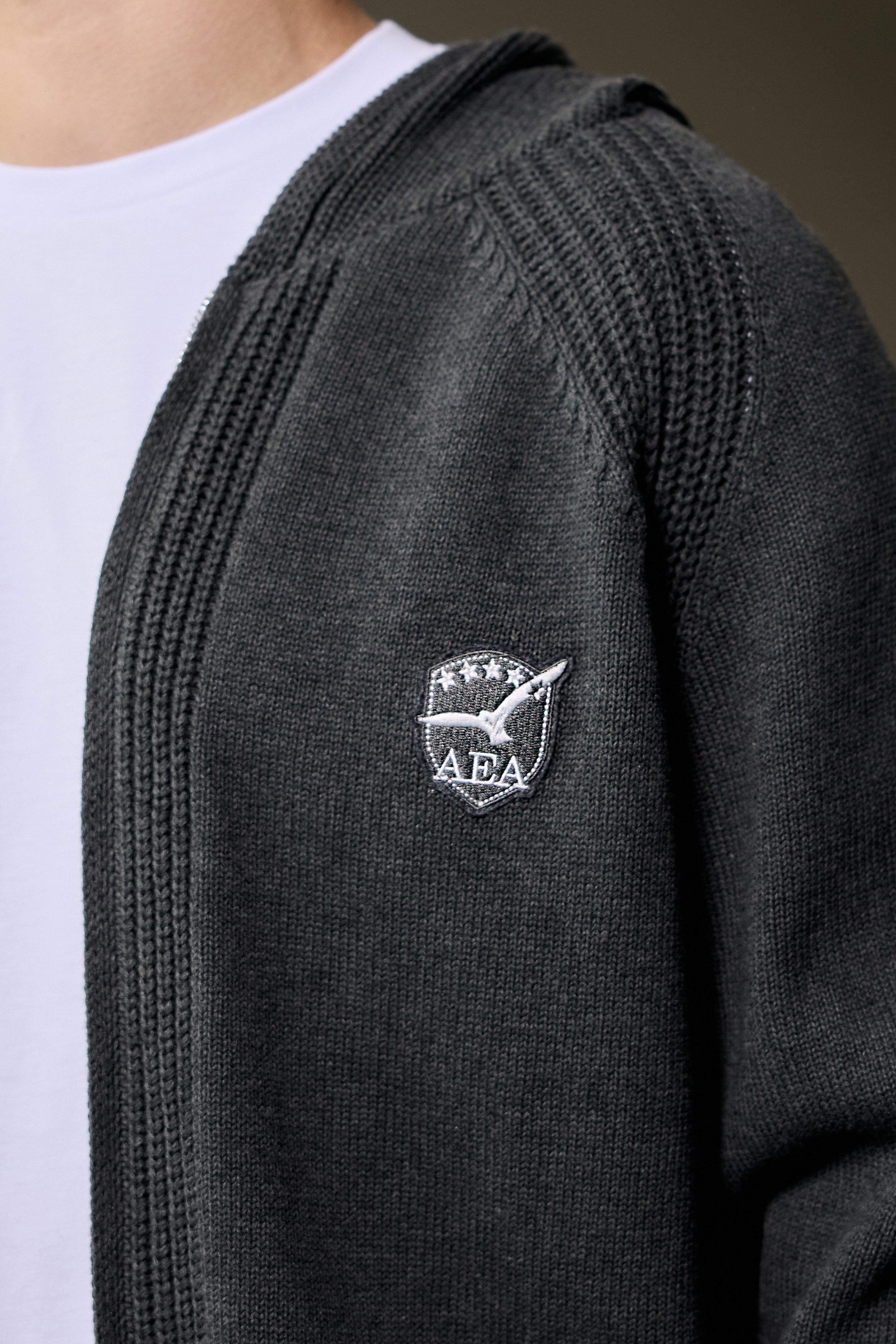 Unisex grey zip-up hoodie with ribbed texture