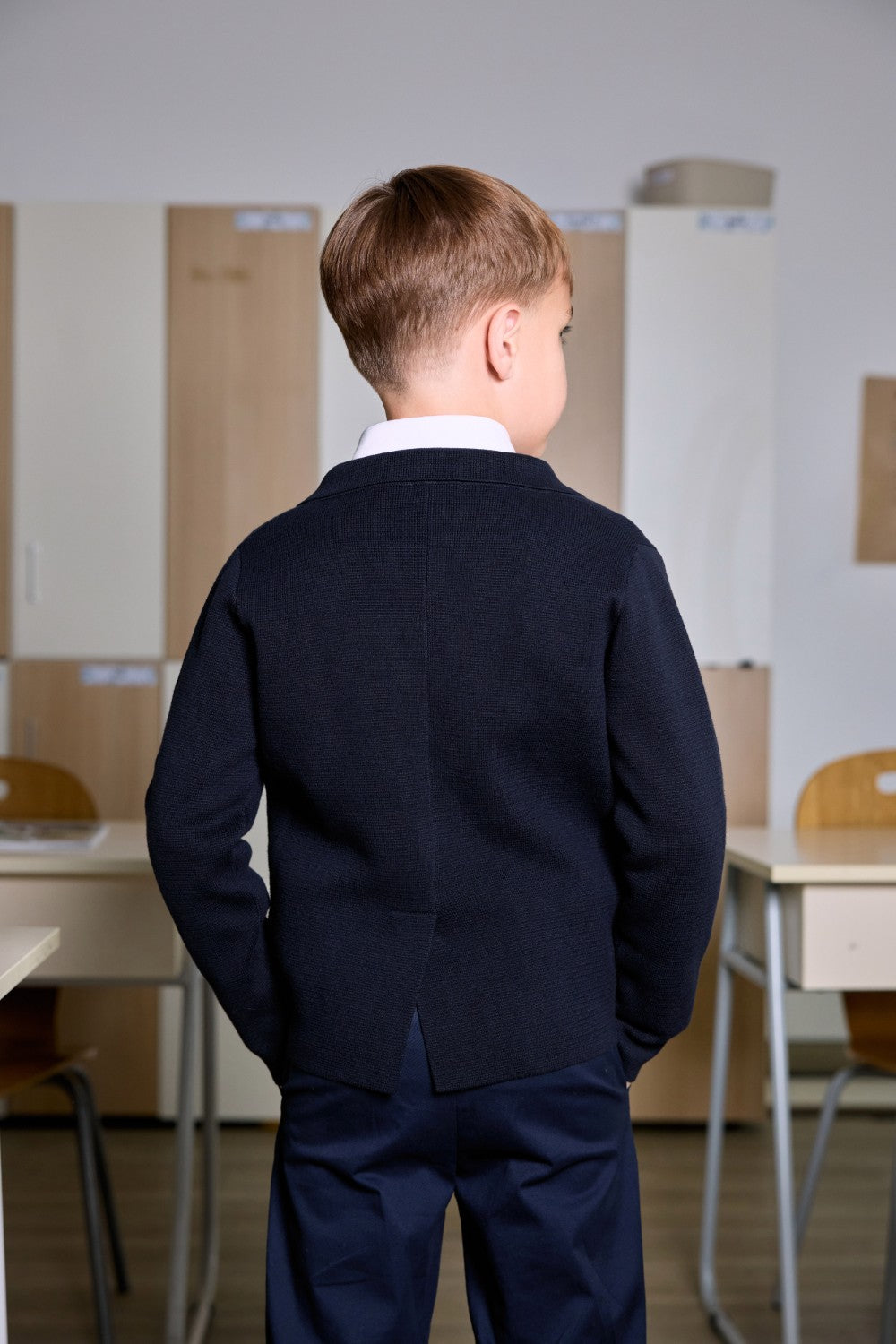 Navy cotton knit cardigan with crest badge and metal buttons