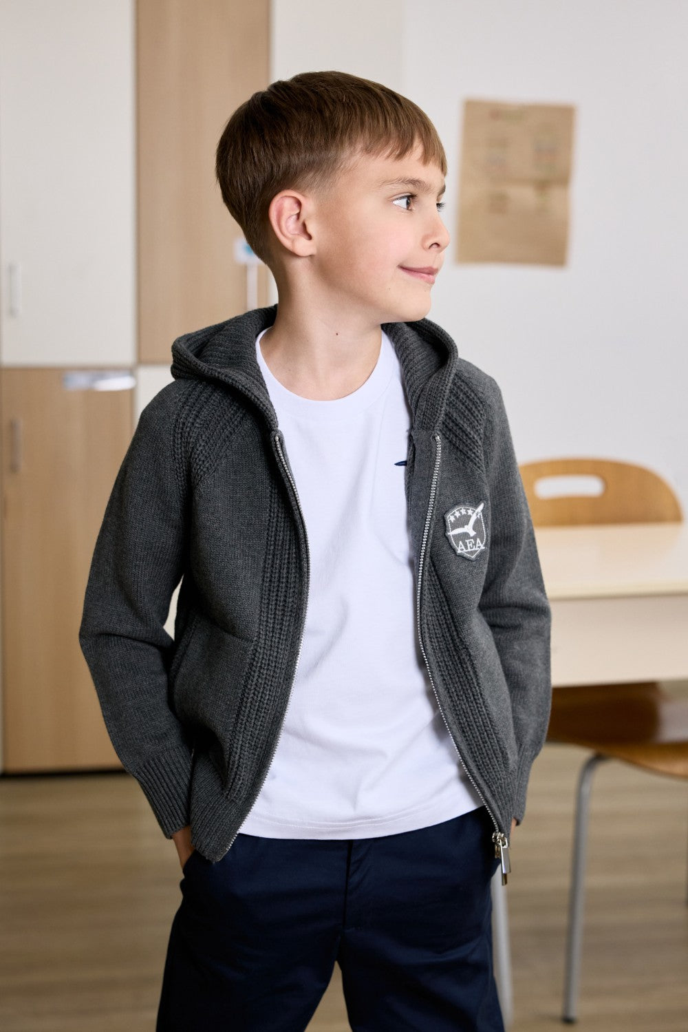 Grey unisex zip-up hoodie with ribbed texture
