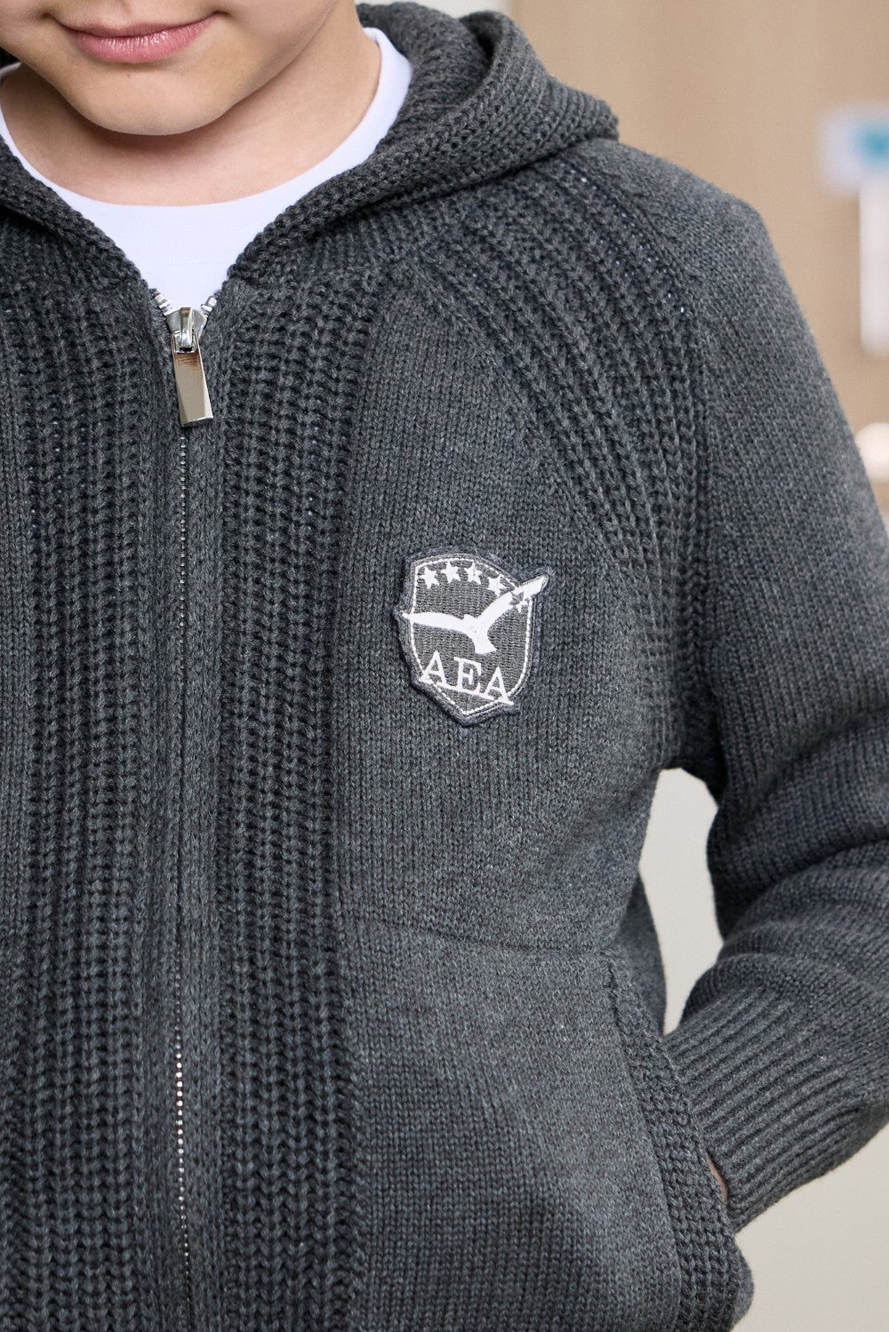 Grey unisex zip-up hoodie with ribbed texture