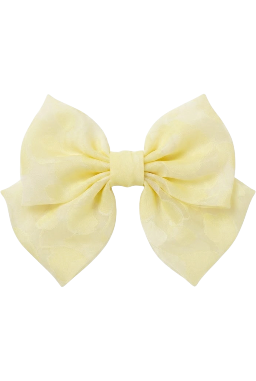 Oversized pale yellow bow hair clip in floral organza - product view