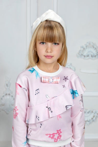Light pink tracksuit with bows print and ruffles
